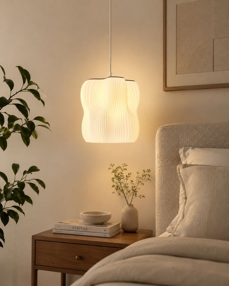 Arya pendant lamp beside a bed