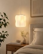 Arya pendant lamp beside a bed