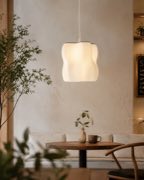Arya pendant lamp above a small table