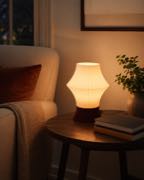 Taurus table lamp beside reading chair